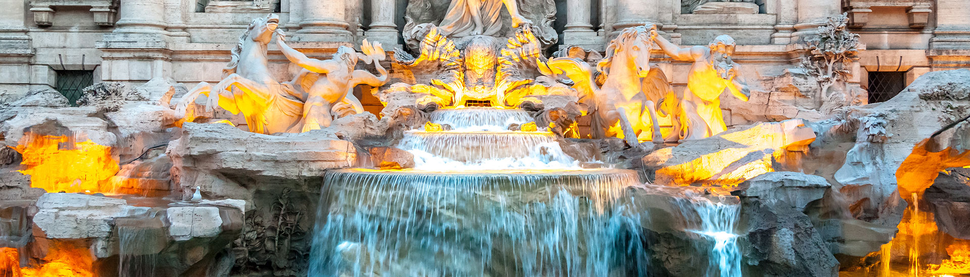 Trevi Fountain lit at dusk
