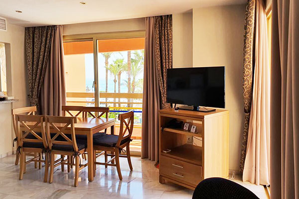 sunset beach club spain dining room with tv